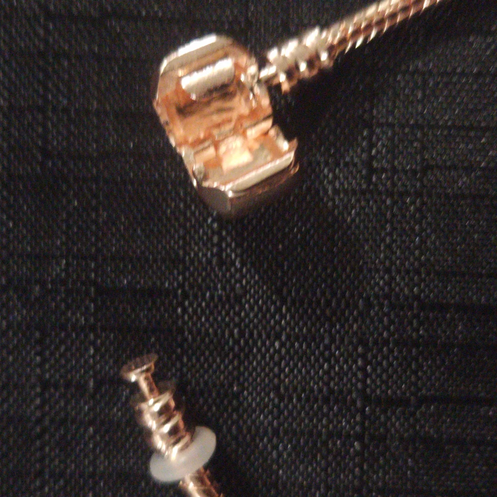 Gold and Pink Charm Bracelet with Ornate Charms. ITEM No. 19-144